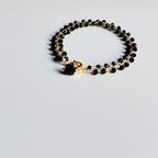 Apyrankė su juodais kristalais