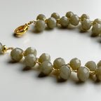 vąšeliu nerta pilkos spalvos stiklo kristalų apyranė su aukso spalvos užsegimu