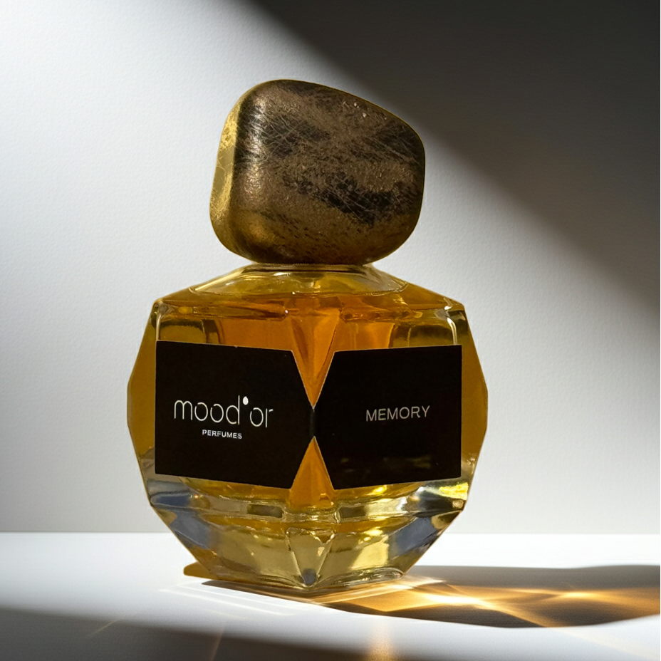 Perfume bottle labeled 'Memory' by mood or' on a white background