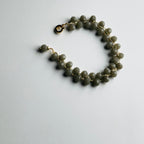 Beaded bracelet on a light gray background